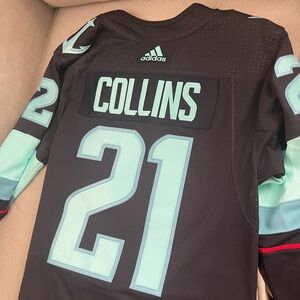 Brand new Seattle Kraken Jersey. Never worn, with tags. Size Medium.